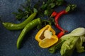 Red and green chilly peppers and half of yellow bell-pepper Royalty Free Stock Photo