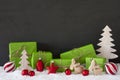 Red And Green Christmas Decoration, Black Cement Wall, Snow Royalty Free Stock Photo