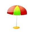 Red green color beach umbrella on stone stand