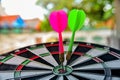 Dart hitting on center with fire on dartboard. Royalty Free Stock Photo