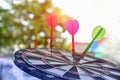 Red and green Darts arrow on the target center dartboard. Royalty Free Stock Photo