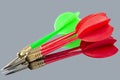 Red and green darts on a mirror background. Hit the target Royalty Free Stock Photo