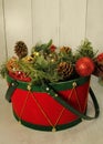 Red and green drum basket, pine cones, poinsettia flowers, red/gold Christmas balls, Royalty Free Stock Photo