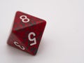 Red and green eight-sided die displaying a 8 Royalty Free Stock Photo