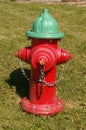 Red and green fire hydrant Royalty Free Stock Photo