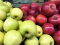 Red and green fresh apples in plastic box Royalty Free Stock Photo