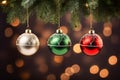 Red, green and gold Christmas baubles hanging in a row on tree Royalty Free Stock Photo
