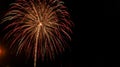 Red, green, and gold fountain firework explosion against a black background on the Fourth of July Royalty Free Stock Photo