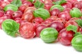 Red and green gooseberries with leaves isolated on white background Royalty Free Stock Photo