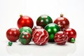 red and green handcrafted christmas ornaments on a white backdrop
