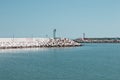 A red and a green lighthouse on the jetty of Pesaro harbour with tetrapod breakwaters Italy, Europe Royalty Free Stock Photo