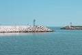 A red and a green lighthouse on the jetty of Pesaro harbour with tetrapod breakwaters Italy, Europe Royalty Free Stock Photo