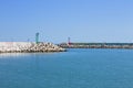 A red and a green lighthouse on the jetty of Pesaro harbour with tetrapod breakwaters Italy, Europe Royalty Free Stock Photo