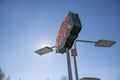 A red and green neon sign with lights and a gorgeous clear blue sky in Decatur Georgia