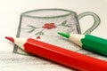 Red and green pencils on the background of a children`s drawing Royalty Free Stock Photo