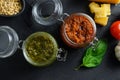 Red and green Pesto alla Genovese , Basil Sauce resh home made and cooking italian recipe ingredients  Parmesan cheese, basil Royalty Free Stock Photo