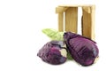 Red and green pointed cabbage in a wooden crate Royalty Free Stock Photo