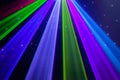 Red, green, purple, white, pink, blue laser lights cutting through smoke machine smoke Royalty Free Stock Photo