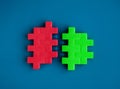 Red and green puzzle blocks between arrows are joining each other on blue background, minimal style.. Royalty Free Stock Photo