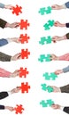 Red and green puzzle pieces in people hands Royalty Free Stock Photo