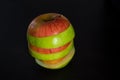 Sliced apple on a black surface Royalty Free Stock Photo