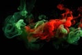 Red, green smoke black background. Color smoke. Water splash. Cosmic stardust. Royalty Free Stock Photo