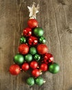 Red and green sparkly Christmas balls, decorations to form tree with white star