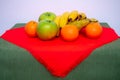 tablecloth with pears, bananas, oranges and fresh green apples Royalty Free Stock Photo