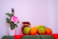 Red and green tablecloth with pears, bananas, oranges and fresh green apples Royalty Free Stock Photo