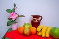 Red and green tablecloth with pears, bananas, oranges and fresh green apples Royalty Free Stock Photo