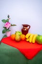 Red and green tablecloth with pears, bananas, oranges and fresh green apples Royalty Free Stock Photo