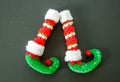 Red and green elf boots isolated on gray Royalty Free Stock Photo