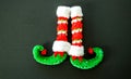 Red and green elf boots isolated on gray Royalty Free Stock Photo