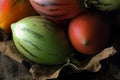 Red and green tree tomato fruit on dry leaves. Royalty Free Stock Photo