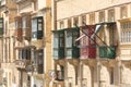 Red and green Valletta balconies