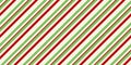 Red and green vintage rough kraft textured seamless diagonal candy cane stripes Christmas decoration pattern