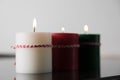 Red, Green And White Pillar Candle Abstract Blurred Christmas Ba