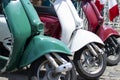 Red, green and white scooters symbolize the prapor of Italy, close-up of transport