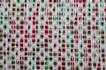 Red, Green and White vintage yarn pattern background. Abstract retro textile fabric backdrop.