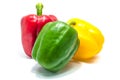Red green and yellow bell peper on white background. Royalty Free Stock Photo