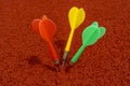 Red, green and yellow colored dart arrows