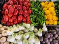 Red  green  yellow peppers and other vegetables on the market Royalty Free Stock Photo