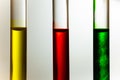 Red green yellow solution dilute in clear liquid in test tube Royalty Free Stock Photo