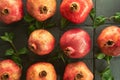 901/5000 Pomegranate fruit on a black background shale stone