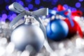 Red, grey and blue christmas balls, blured purple lights at the background Royalty Free Stock Photo