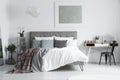 Checkered bedsheets lying on bed Royalty Free Stock Photo