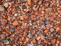 Red and grey rocks on ground Royalty Free Stock Photo
