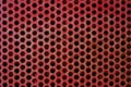 Red metal grid circle holes painted iron industrial texture background Royalty Free Stock Photo