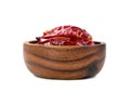 Red ground paprika or dry chili pepper in wooden bowl isolated on white background Royalty Free Stock Photo