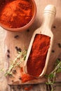 Red ground paprika spice in wooden scoop and bowl Royalty Free Stock Photo